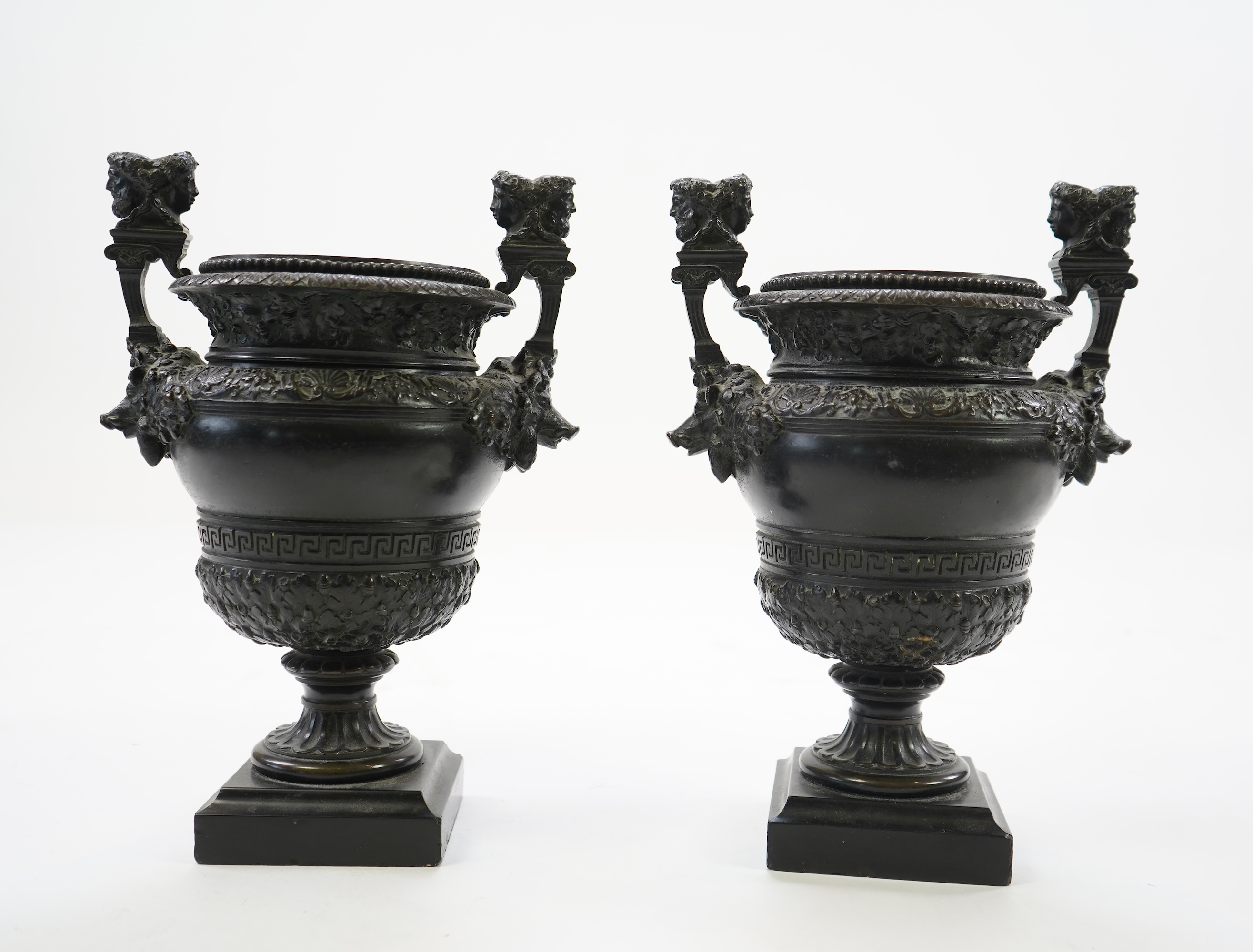 A pair of neoclassical revival bronze urns, late 19th century